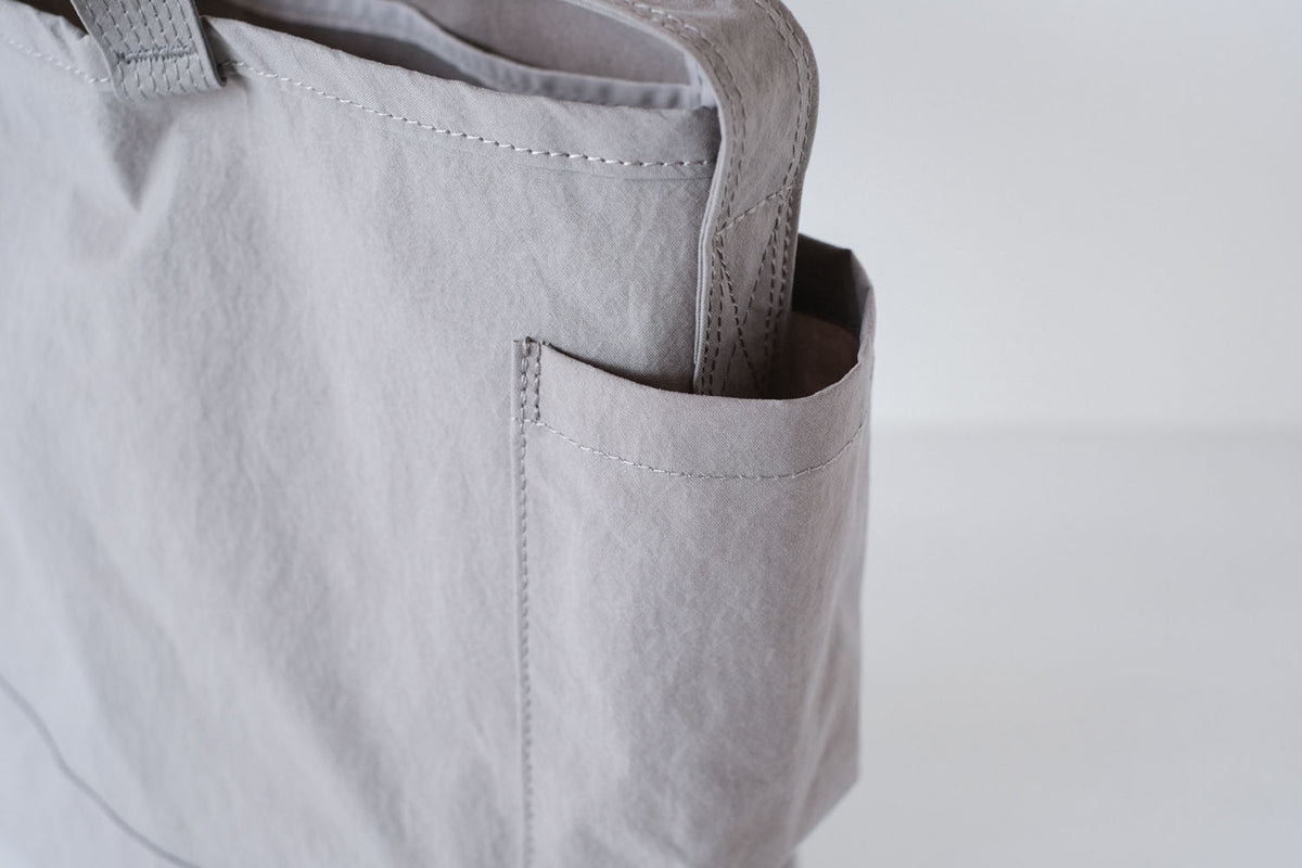 SIDE POCKET TOTE / BLUE / ANUNFOLD